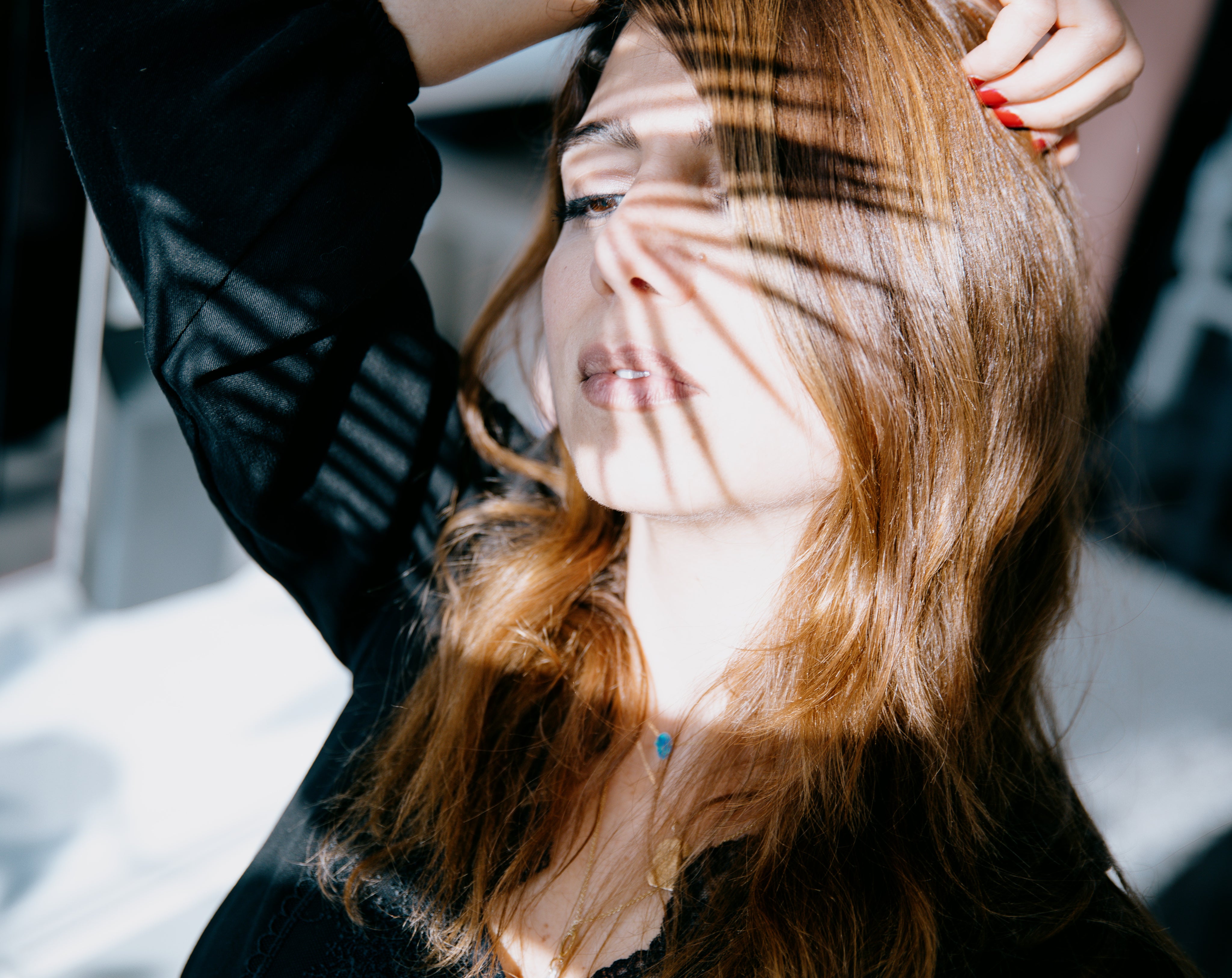 files/woman-with-the-shadow-of-a-spiky-plant-on-her-face.jpg